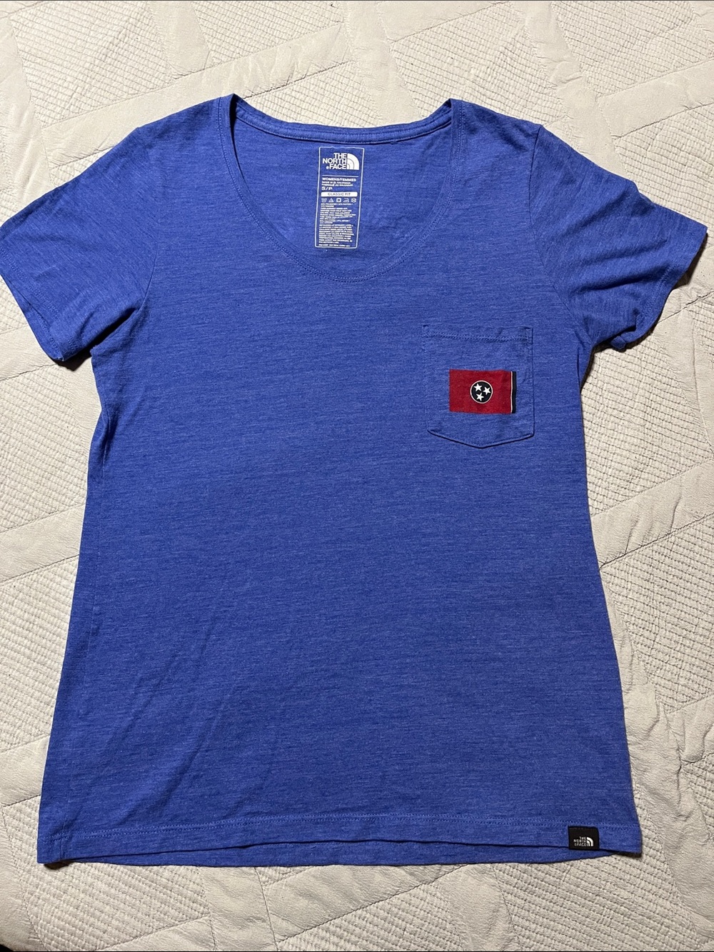 The North Face Women's Royal Blue V-Neck Tee with Red Pocket Patch